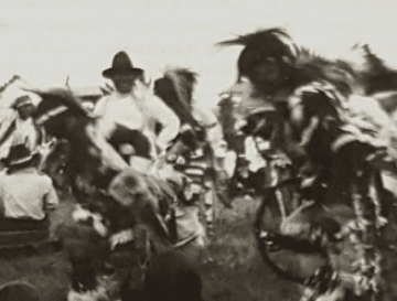 Historic photograph of dancers at a powwow