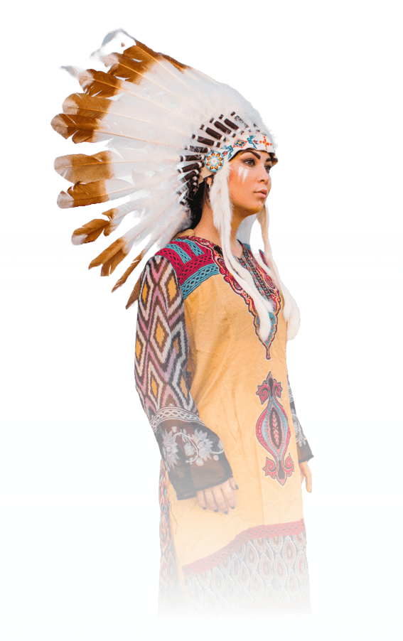 A Nakota dancer photographed against the prairie sky